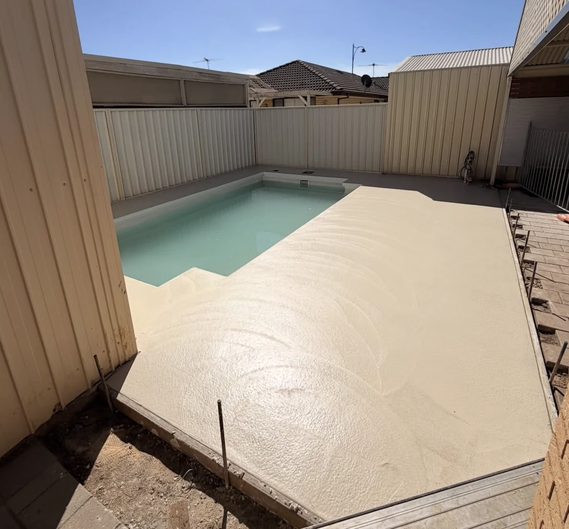 After: newly poured concrete around the same Burton pool, before honing