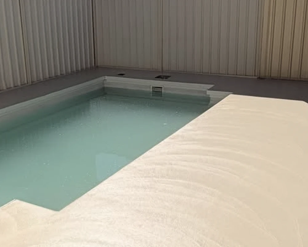 After: newly poured concrete around the same Burton pool, before honing