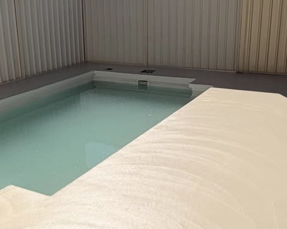 After: newly poured concrete around the same Burton pool, before honing